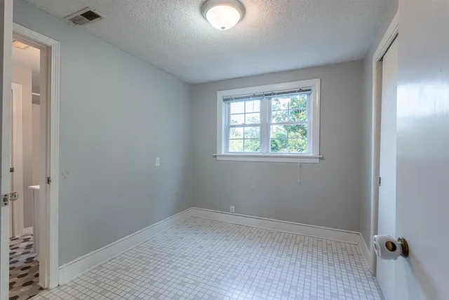 an empty room with windows