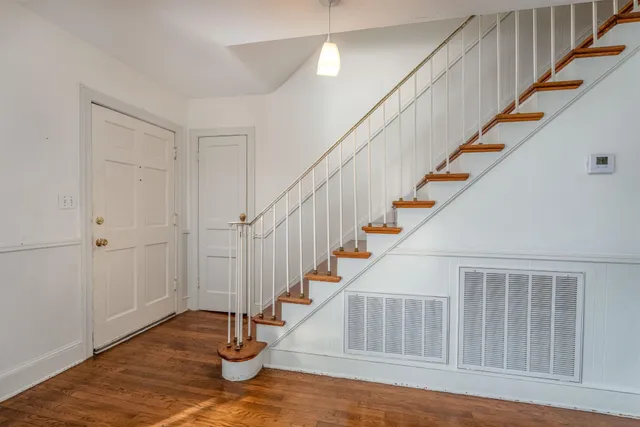a view of entryway with wooden floor