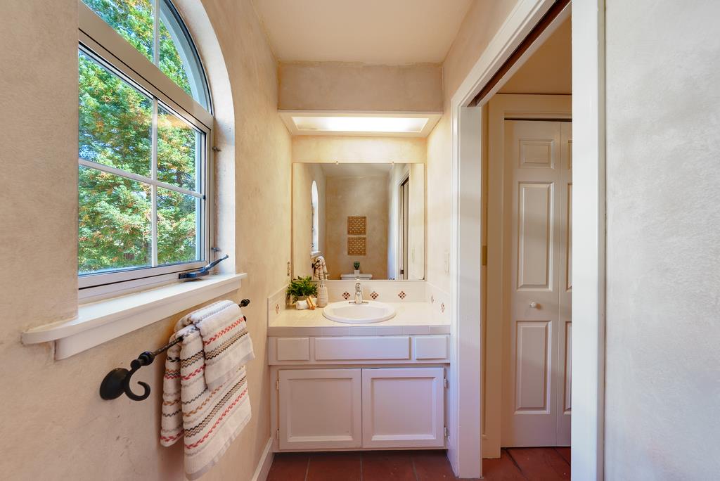 918 3rd Street, Unit A Santa Cruz, CA 95060 - Photo 22 of 43 a bathroom with a sink mirror and vanity