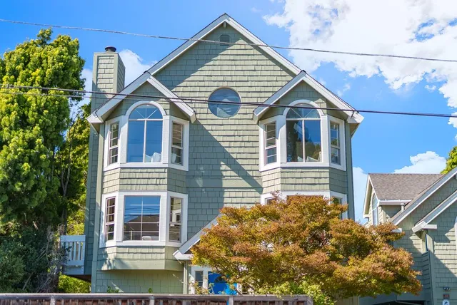 a front view of a house with garden