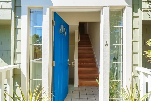 a view of a balcony with wooden floor and stairs