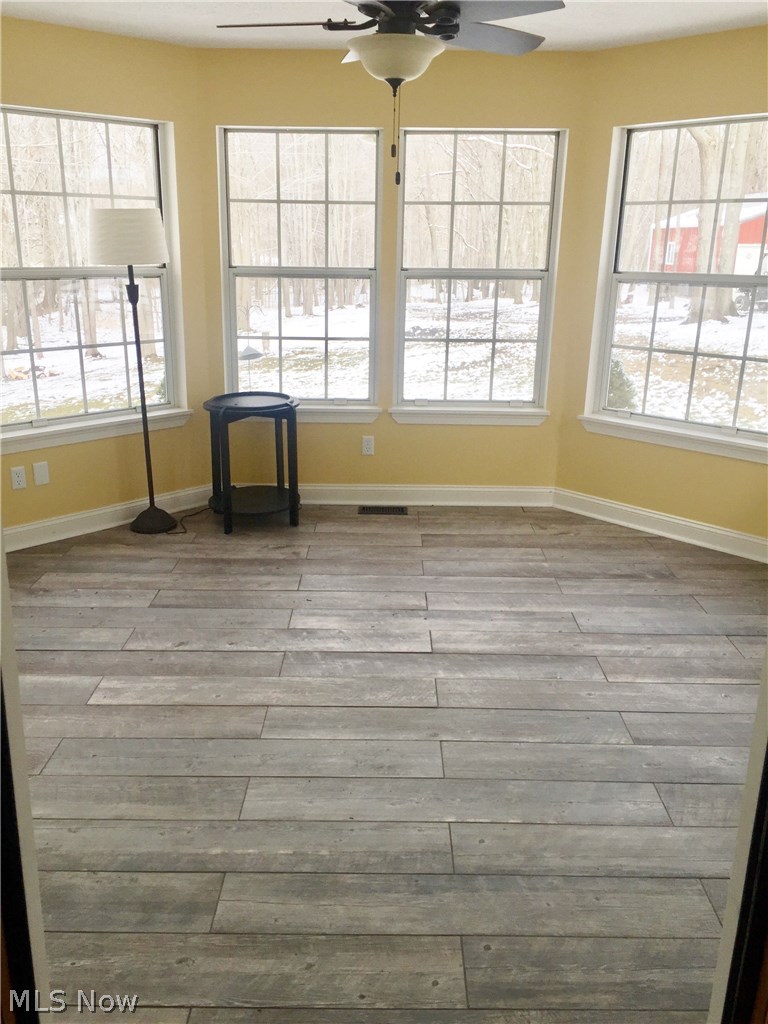 8627 Whipporwill Road Ravenna, OH 44266 - Photo 20 of 34 Great space to sit and relax or entertain. New sliding glass doors leading onto decks off both sides of this beautiful room. New tile floors and paint.