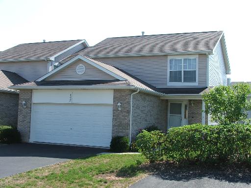 347 Milano Drive Cary, IL 60013 - Photo 1 of 1 a front view of a house with a garden