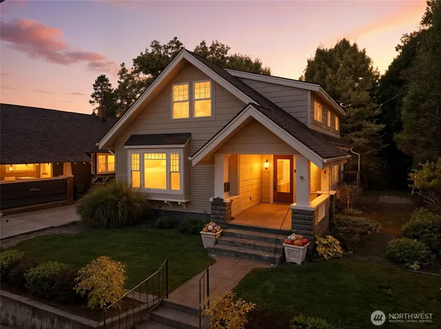 a backyard of a house with lots of green space and outdoor seating