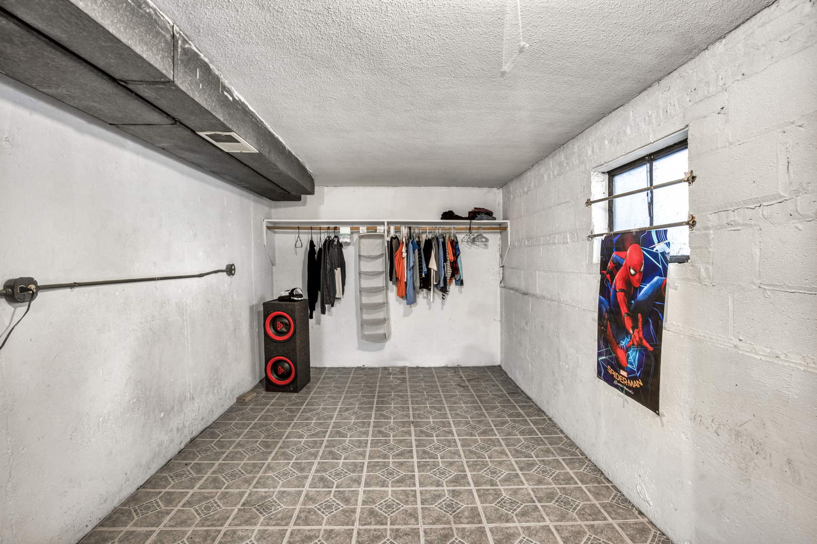 243 Custer Avenue Evanston, IL 60202 - Photo 14 of 17 a view of water heater room with clothes and shoes
