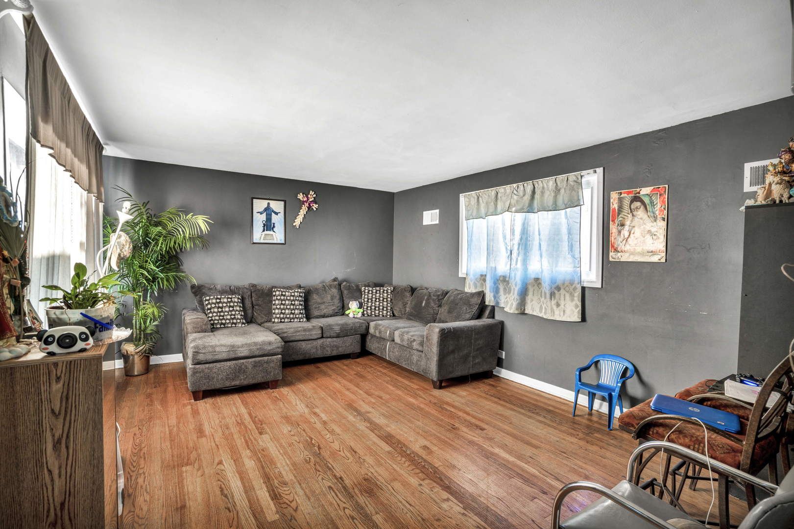 243 Custer Avenue Evanston, IL 60202 - Photo 4 of 17 a living room with furniture and a flat screen tv