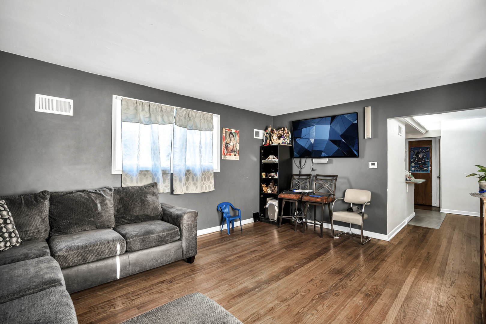 243 Custer Avenue Evanston, IL 60202 - Photo 5 of 17 a living room with furniture and a wooden floor