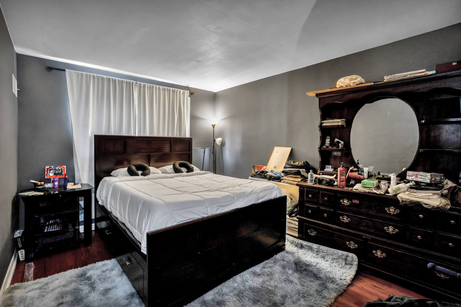 243 Custer Avenue Evanston, IL 60202 - Photo 9 of 17 a bedroom with a bed and a dresser