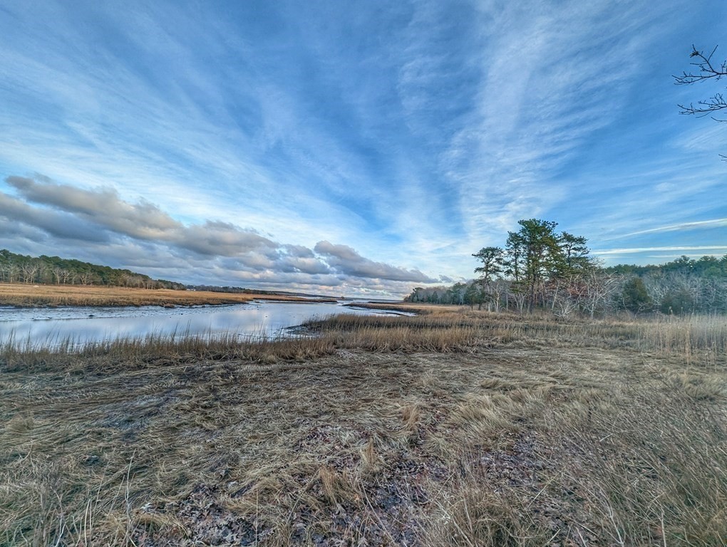 120 Cromesett Road Wareham, MA 02571 - Photo 4 of 12 a view of a dry yard with wooden floor and fence