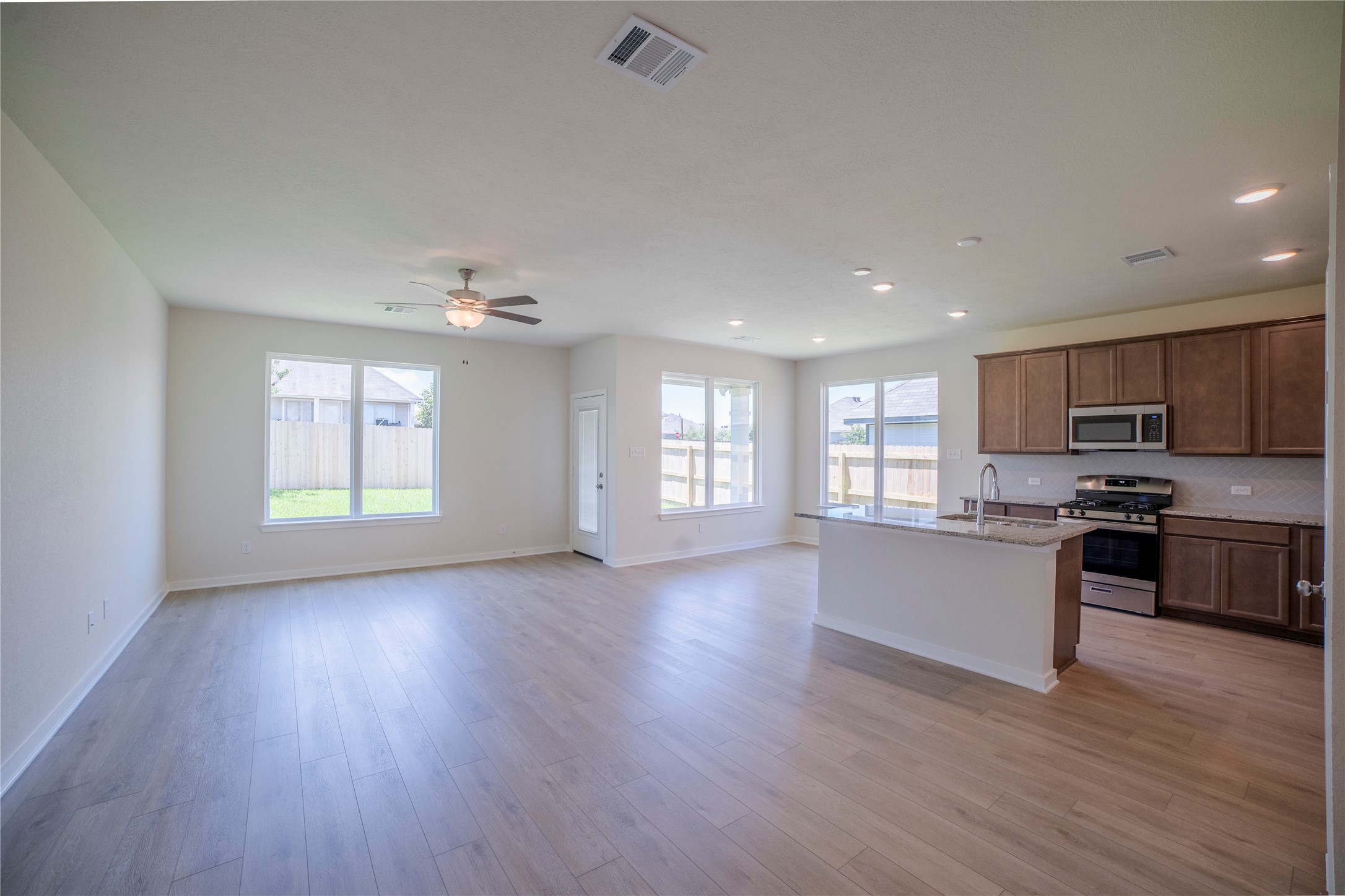 1402 Lk Rdg Drive Brenham, TX 77833 - Photo 17 of 35 a view of a kitchen with a sink and a stove top oven