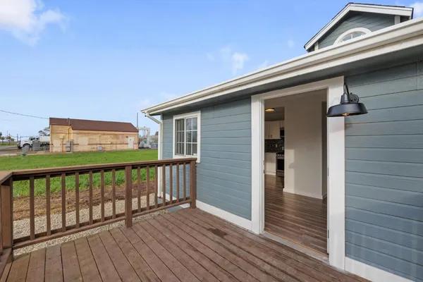 a view of a balcony with wooden floor