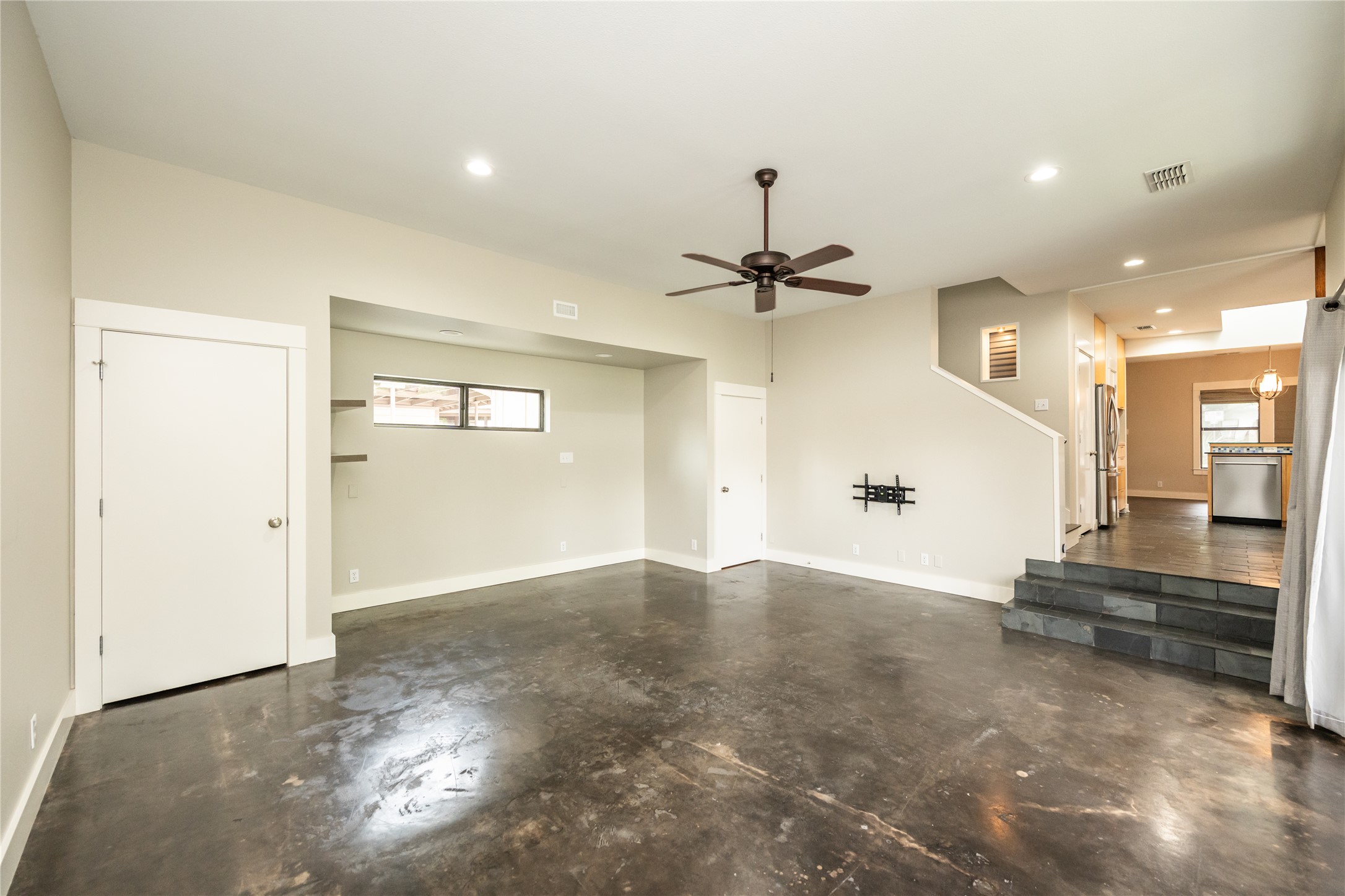 2103 Kinney Avenue Austin, TX 78704 - Photo 23 of 40 Spacious living room featuring polished concrete floors, recessed lighting, and a ceiling fan
