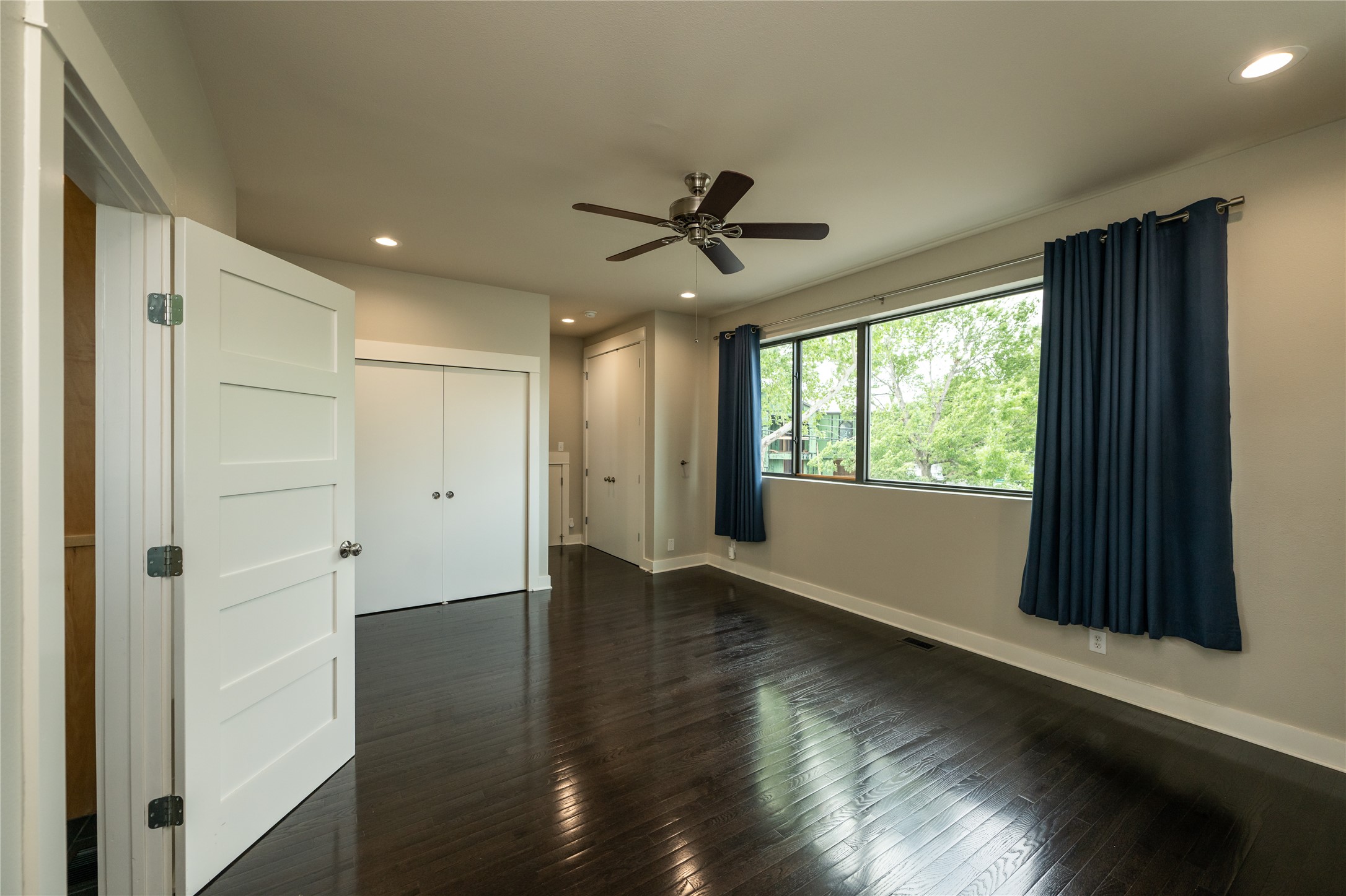 2103 Kinney Avenue Austin, TX 78704 - Photo 26 of 40 Primary bedroom featuring dark hardwood flooring, recessed lighting, and a ceiling fan