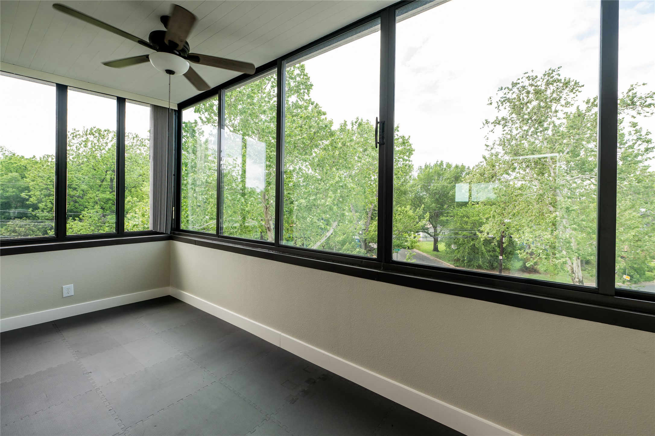 2103 Kinney Avenue Austin, TX 78704 - Photo 38 of 40 This bright space features extensive windows, offering abundant natural light and views of mature trees