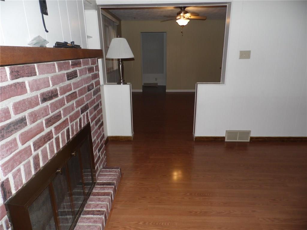 507 Kennedy Road Charleroi, PA 15022 - Photo 11 of 24 Fireplace has gas log fueled by outside propane. Open into the dining room or could be used as a family room.