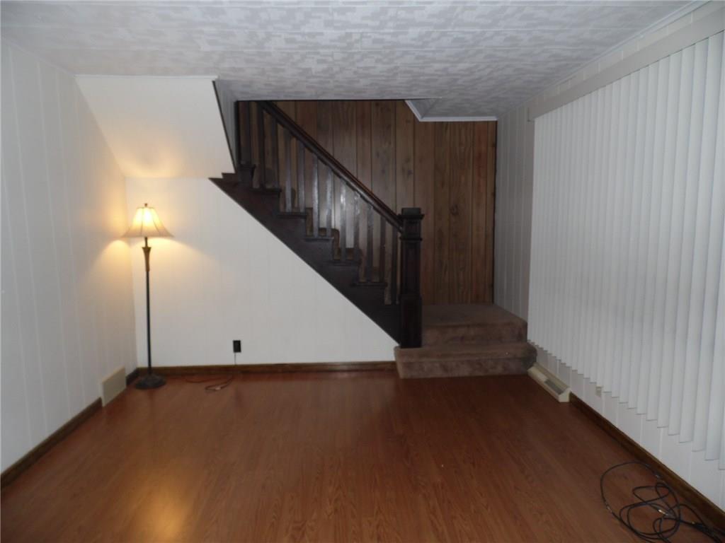 507 Kennedy Road Charleroi, PA 15022 - Photo 4 of 24 Custom blinds and the stairs lead up to the bedrooms.