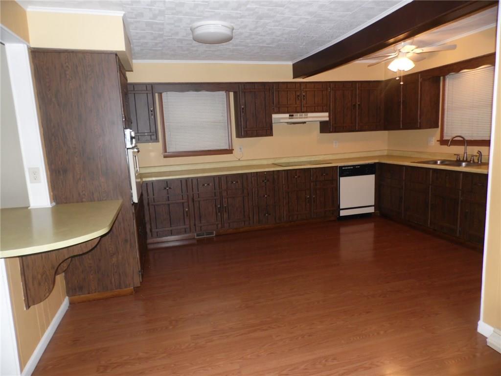 507 Kennedy Road Charleroi, PA 15022 - Photo 6 of 24 Breakfast counter divider is a nice feature. There's an "Induction" electric cooktop, dishwasher, and lighted vent included.