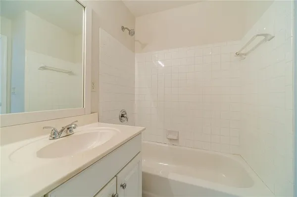 a bathroom with a double vanity sink mirror and
