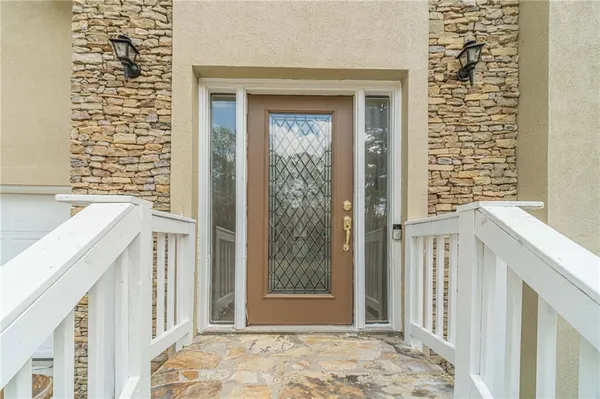 a view of entryway with wooden floor and stairs
