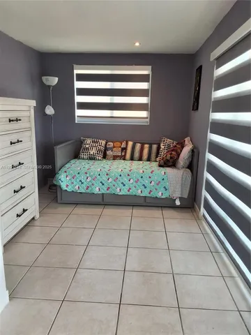 a view of room with window and stairs