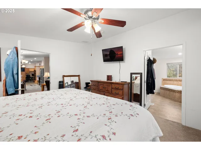 a bathroom with a sink mirror and window