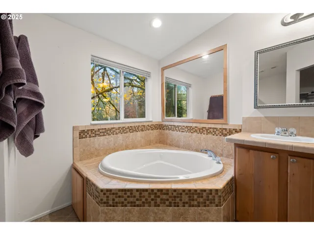 a bedroom with a bed and a television