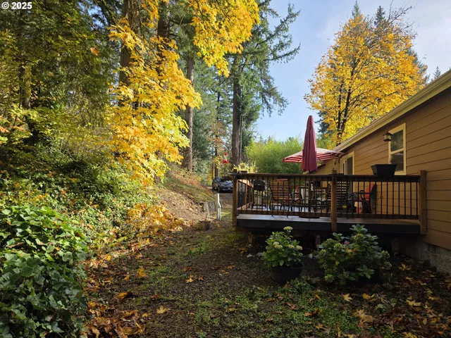 a view of balcony with wooden fence and floor