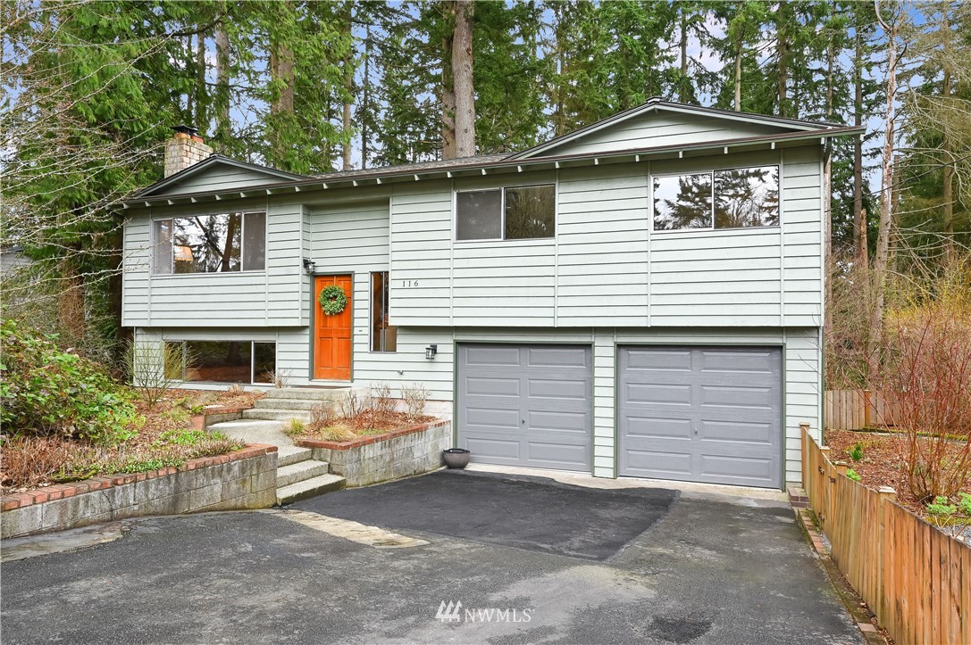 116 East Jonathan Road Bothell, WA 98012 - Photo 1 of 27 a front view of a house with a garage