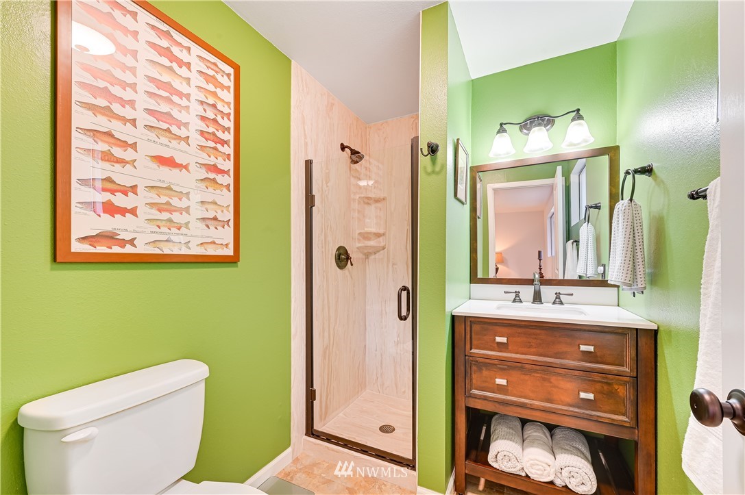 116 East Jonathan Road Bothell, WA 98012 - Photo 11 of 27 a bathroom with a toilet sink and mirror
