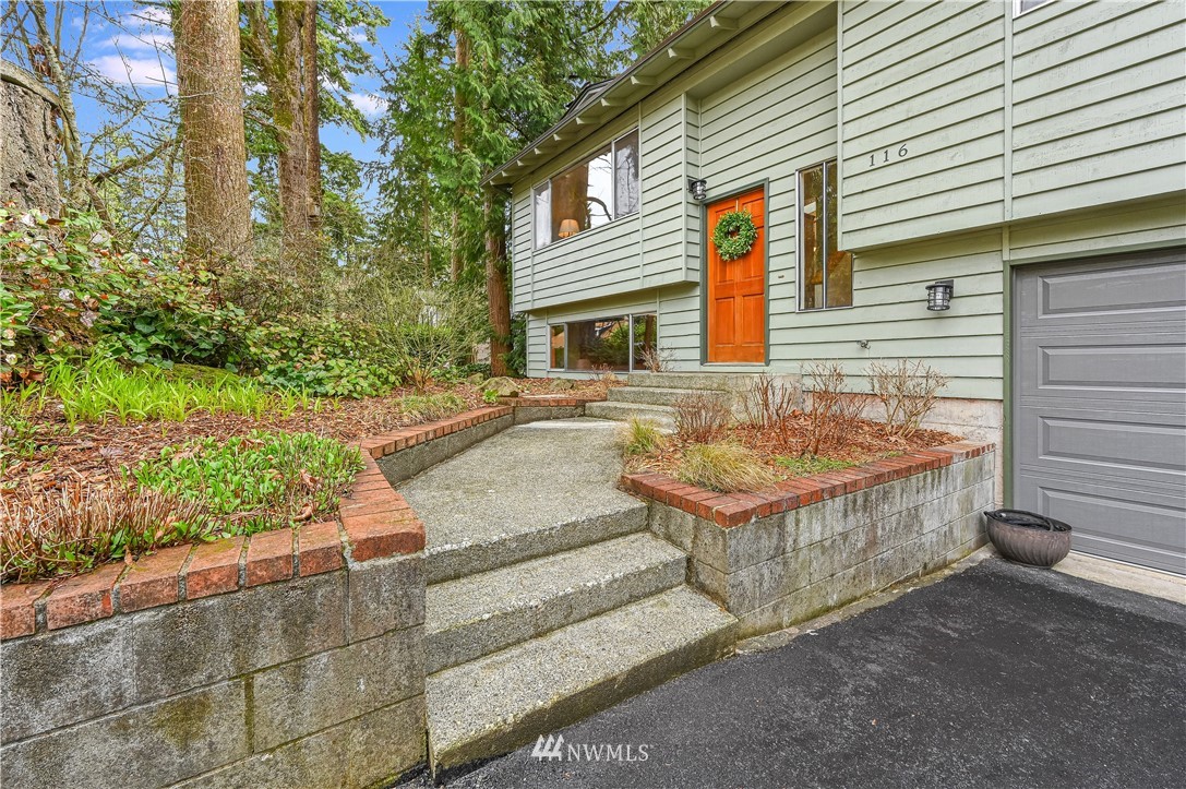 116 East Jonathan Road Bothell, WA 98012 - Photo 2 of 27 a front view of a house with a yard