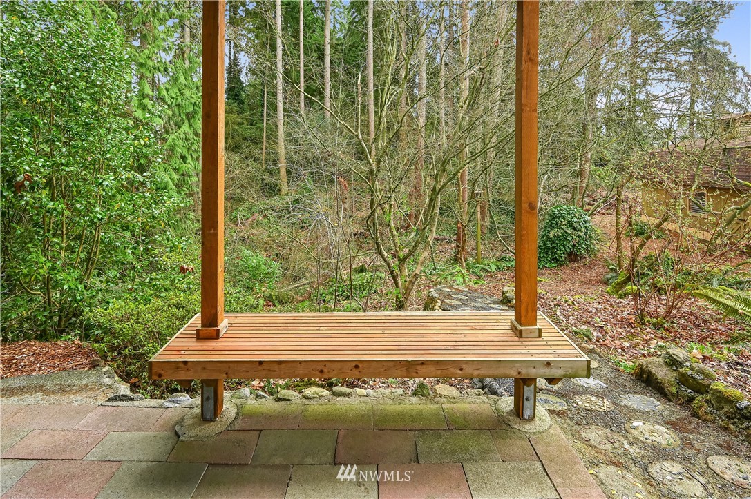 116 East Jonathan Road Bothell, WA 98012 - Photo 23 of 27 a view of a bench in a yard