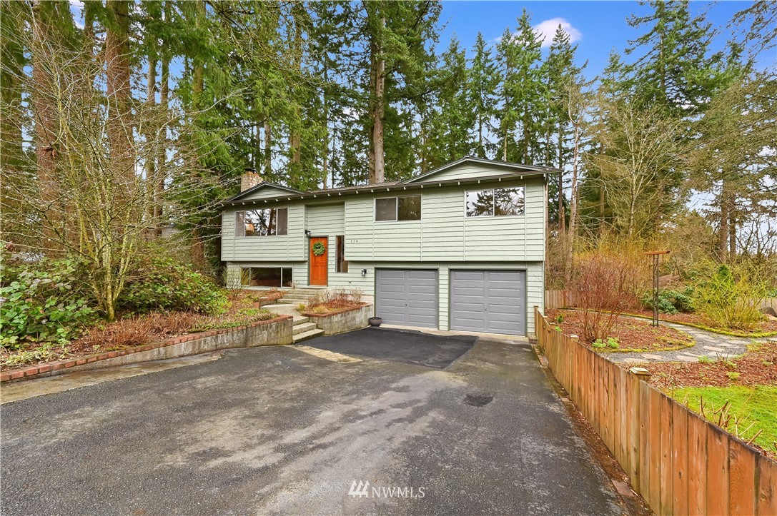 116 East Jonathan Road Bothell, WA 98012 - Photo 26 of 27 front view of a house with a yard and an trees