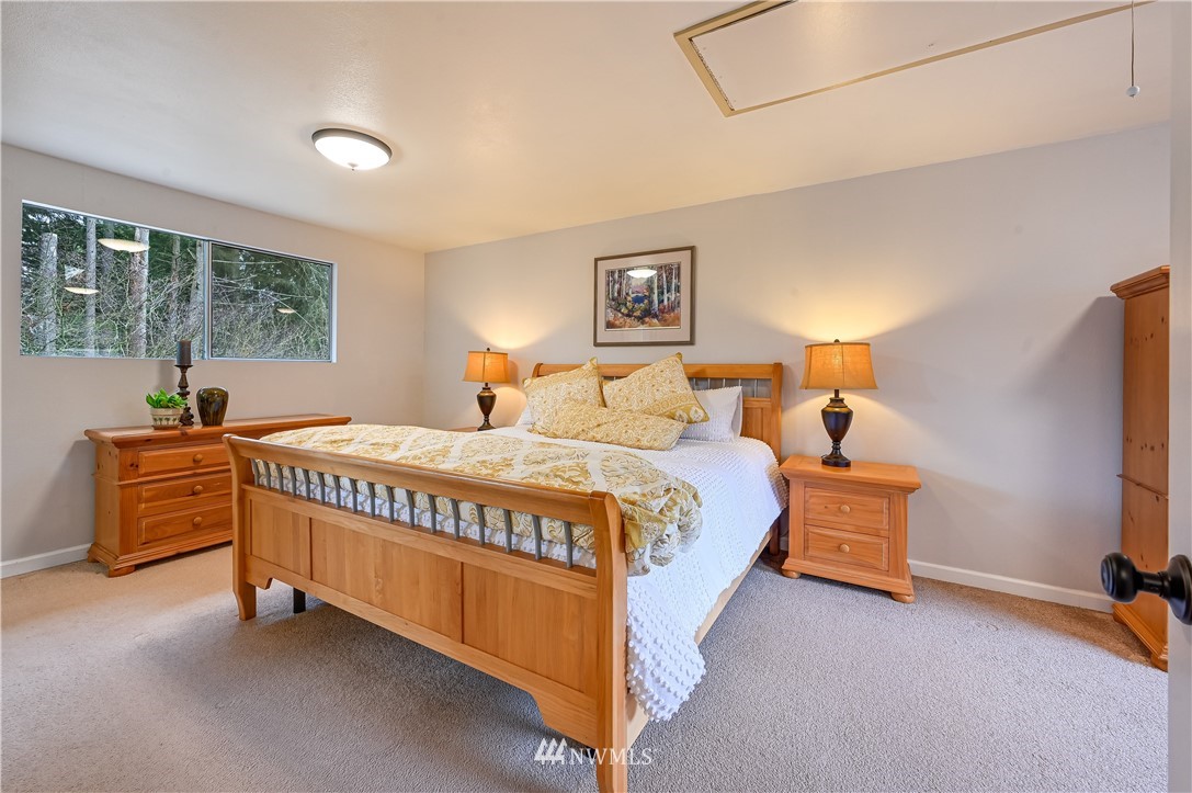 116 East Jonathan Road Bothell, WA 98012 - Photo 9 of 27 a bed room with a bed and a couch
