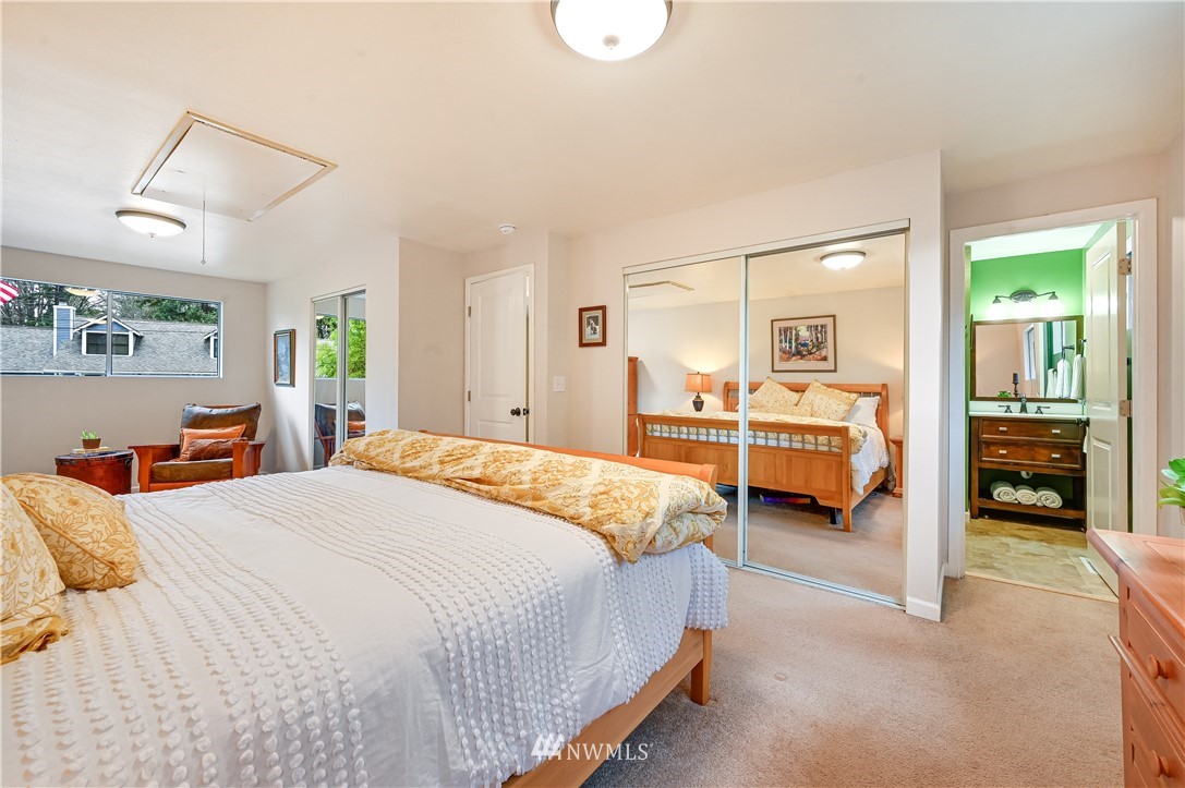 116 East Jonathan Road Bothell, WA 98012 - Photo 10 of 27 a bedroom with bed and a large mirror