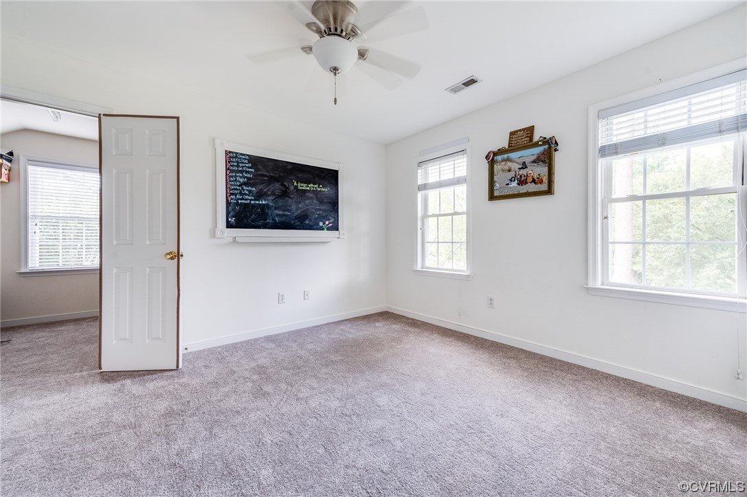 12118 Club Ridge Drive Chester, VA 23836 - Photo 24 of 38 4th bedroom with a Large walk-in closet, ceiling fan, carpet, and natural light