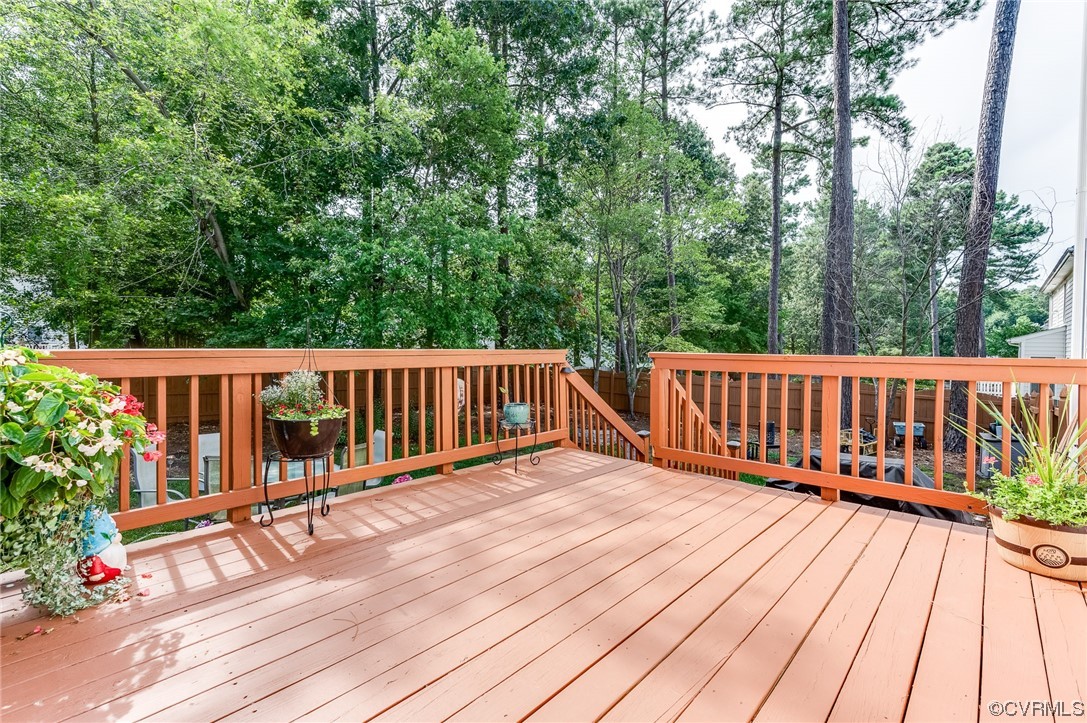 12118 Club Ridge Drive Chester, VA 23836 - Photo 26 of 38 View of wooden deck, with large fenced in level lot