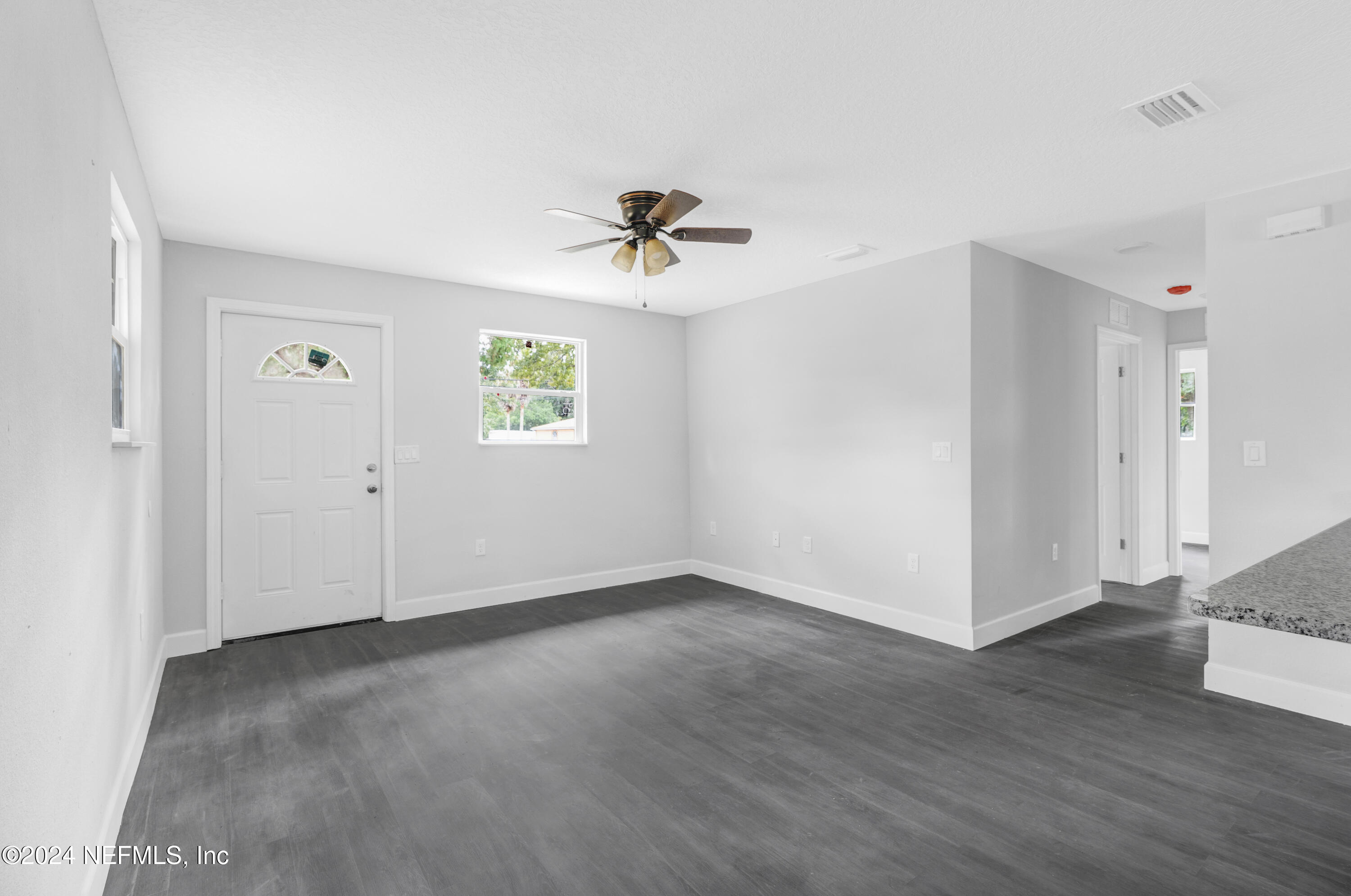 7301 Melvin Road Jacksonville, FL 32210 - Photo 3 of 27 a view of an empty room with a window