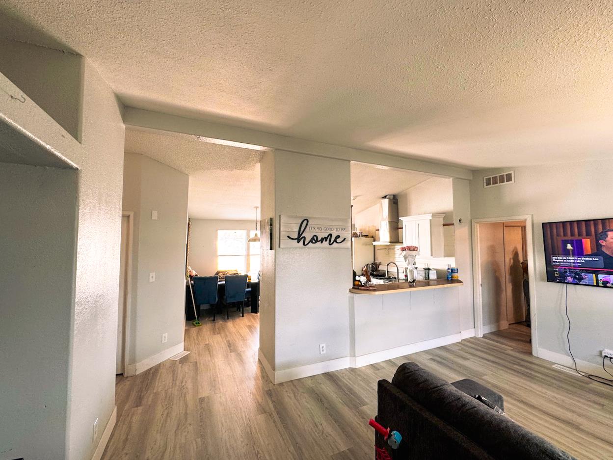 3939 Central Avenue, Unit 35 Ceres, CA 95307 - Photo 12 of 36 a living room with furniture and a flat screen tv
