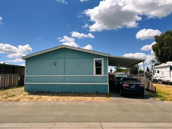 a front view of a house with parking space
