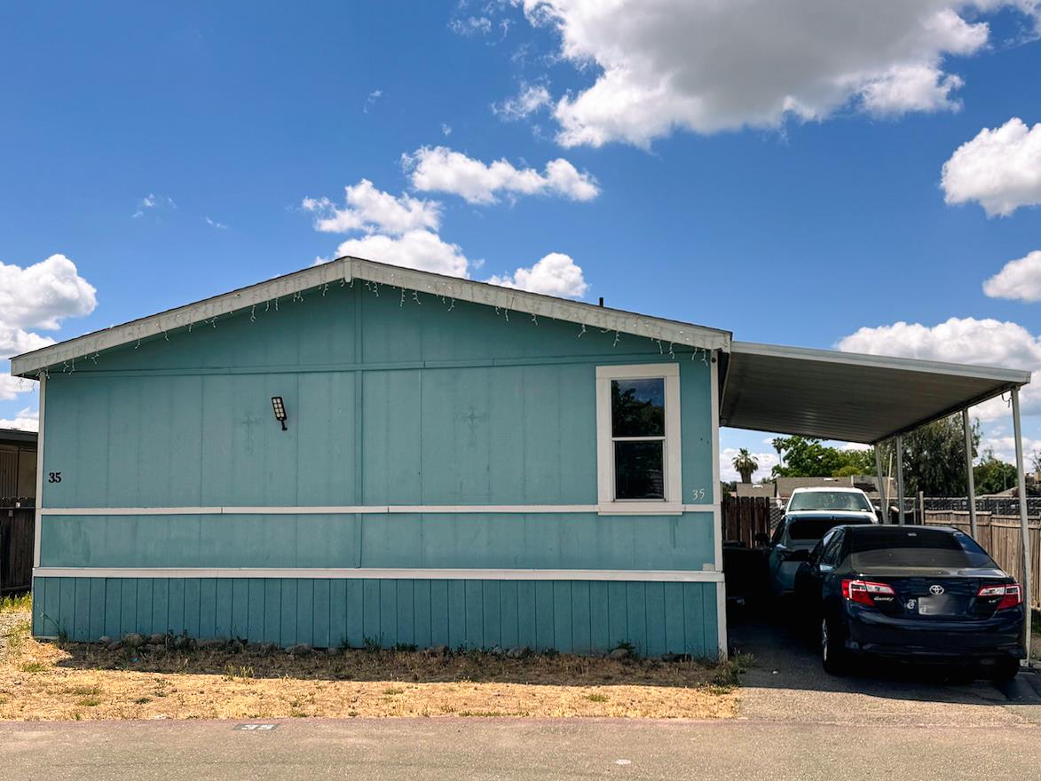 3939 Central Avenue, Unit 35 Ceres, CA 95307 - Photo 36 of 36 a front view of a house with a garden