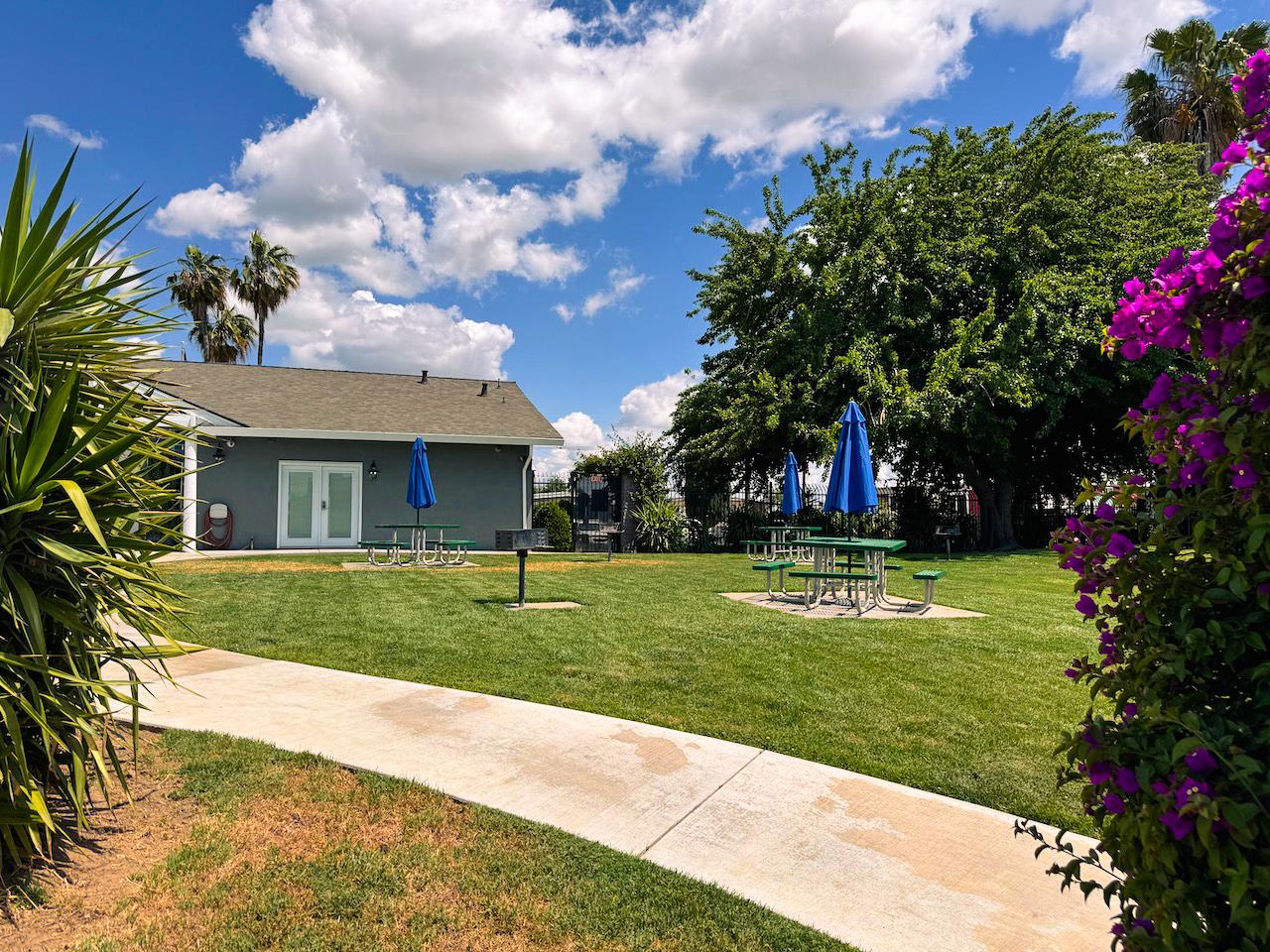 3939 Central Avenue, Unit 35 Ceres, CA 95307 - Photo 6 of 36 a front view of a house with a yard and trees