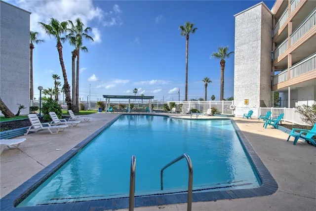 a view of a living room and kitchen