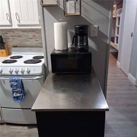 a view of water heater room with washer and dryer
