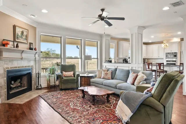 a living room with furniture and a fireplace