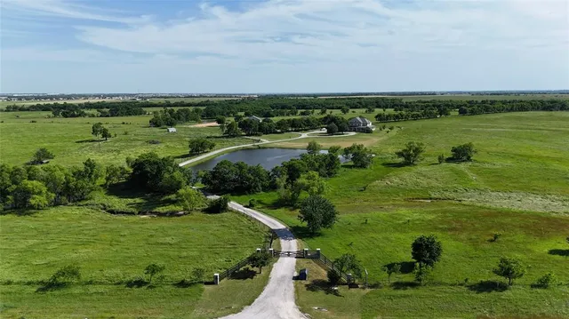 an aerial view of a houses with outdoor space