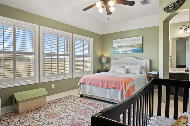 a bedroom with a bed and a window