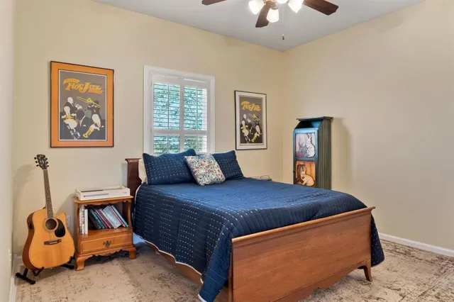 a bedroom with a bed and a mirror