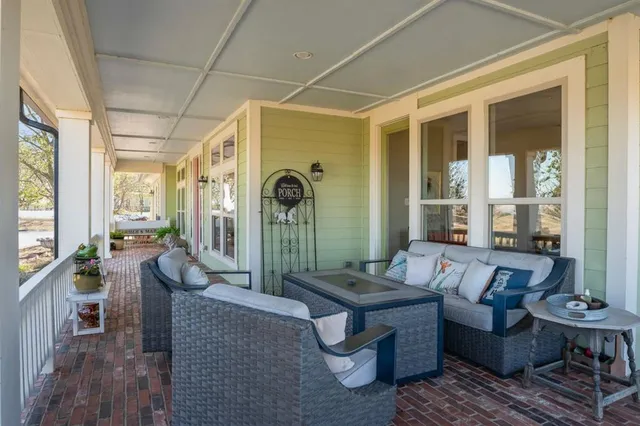 a view of a porch with wooden floor