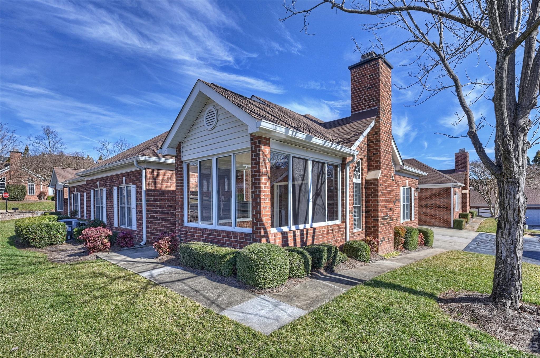 8445 Windsor Ridge Drive Charlotte, NC 28277 - Photo 1 of 26 a front view of a house with garden