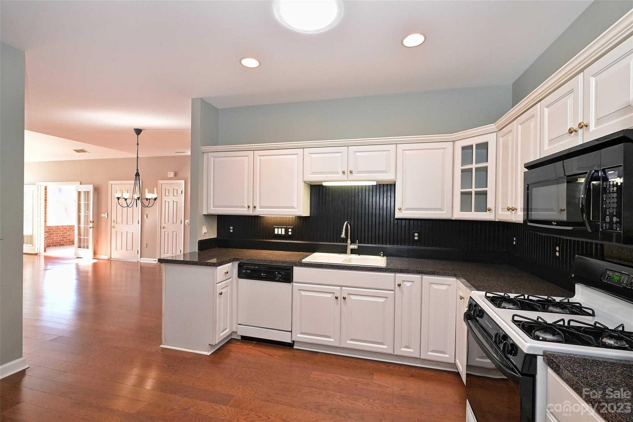 8445 Windsor Ridge Drive Charlotte, NC 28277 - Photo 14 of 26 a kitchen with stainless steel appliances a sink stove and cabinets